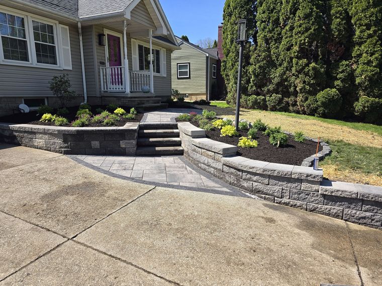 The finished front entry: block retaining wall, steps and new paver walkway